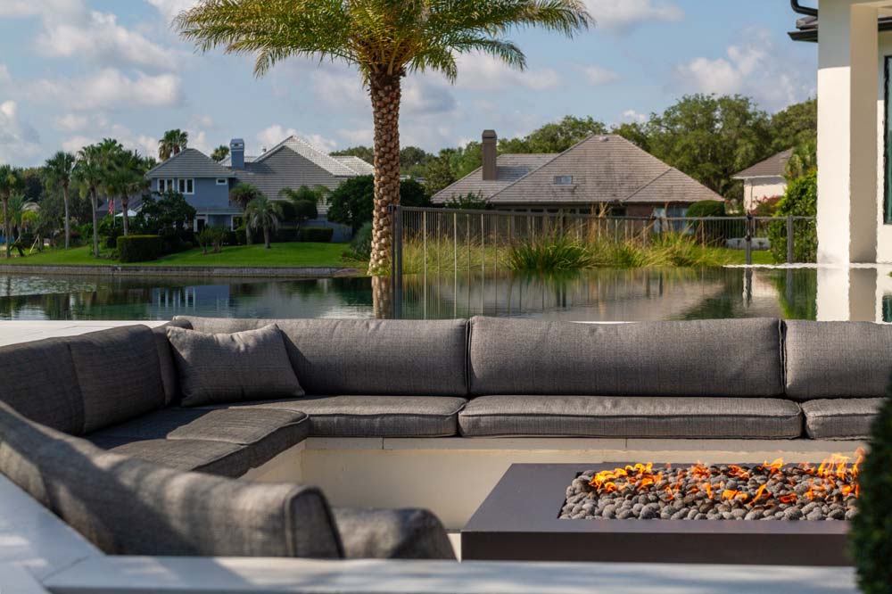 Modern outdoor living area featuring a cozy fire pit for gatherings in Jacksonville, FL